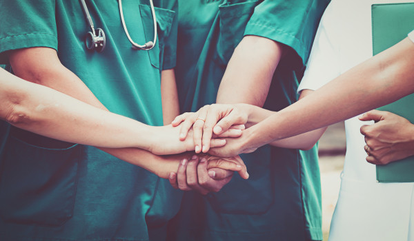 medics touching hands