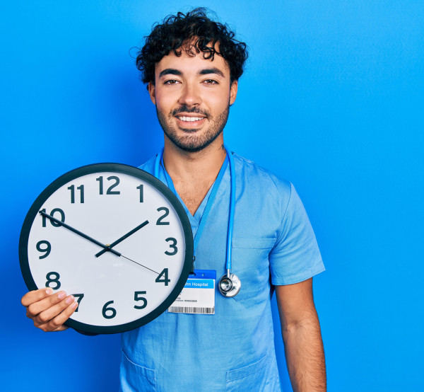 smiling nurse with clock