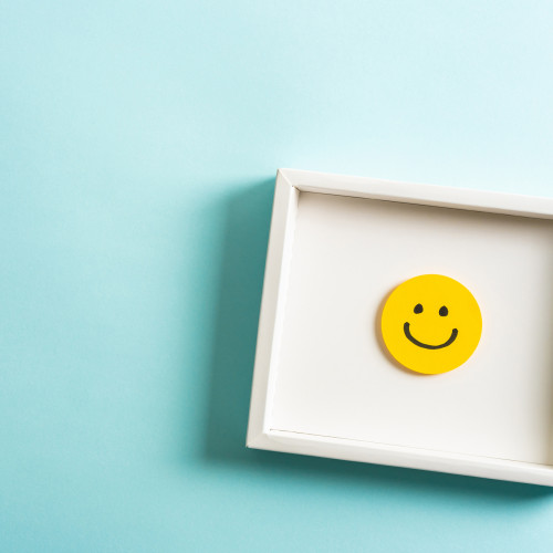 smiley face emoji in a frame