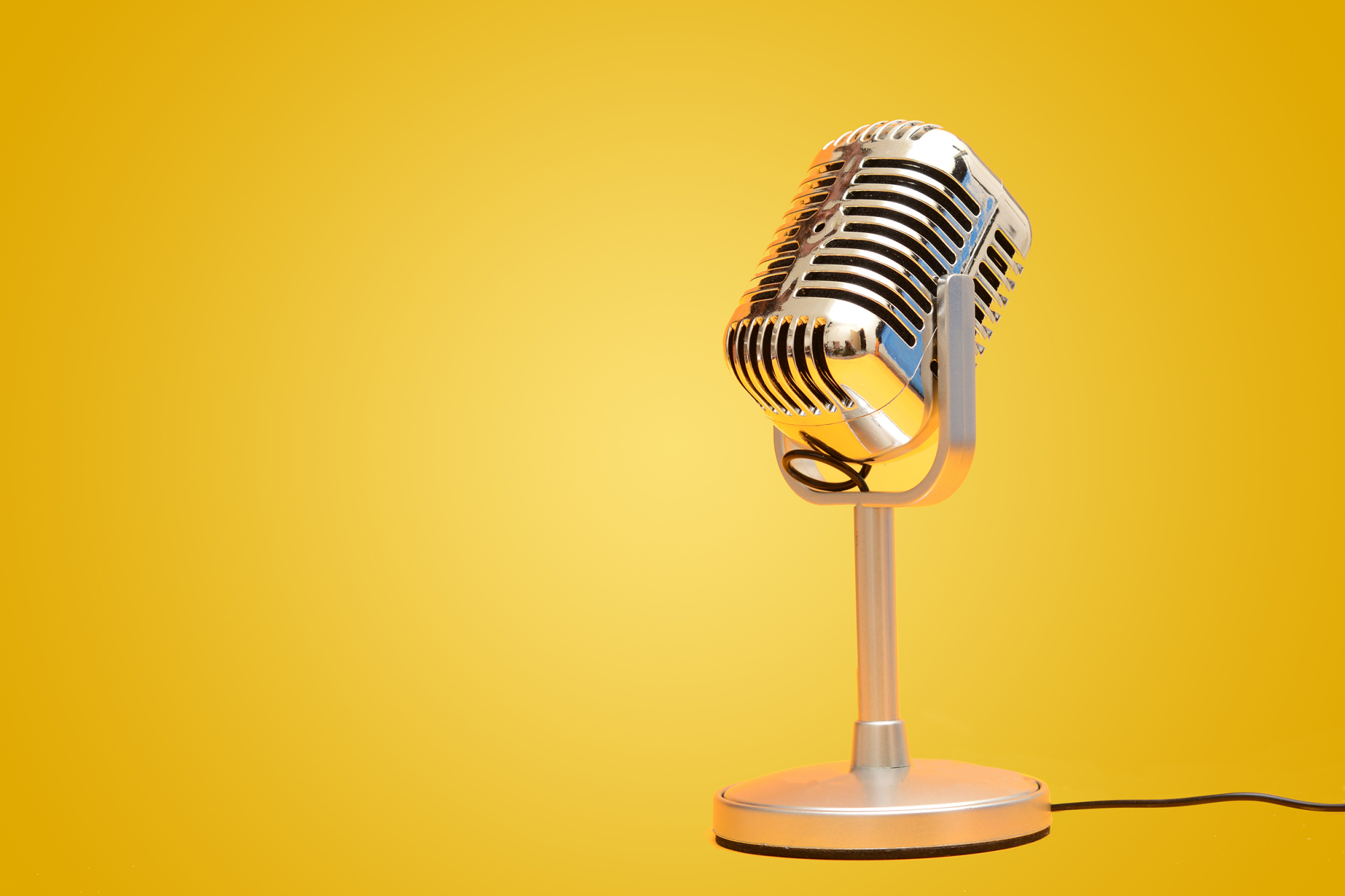 retro microphone on yellow background