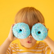 Image of boy with doughnuts over eyes