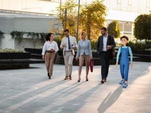 A picture showing social workers walking alongside a System C social care character.
