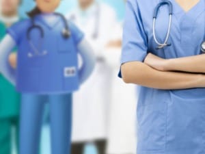 a picture of a male and female healthcare workers stood next to a System C cartoon character.