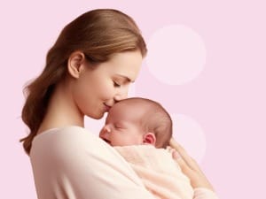 a picture of a mother smiling and holding a baby with the System C logo in the background.