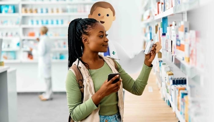 A picture of a Medicines Management System C character stood with a customer in a pharmacy setting.