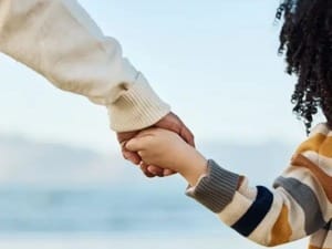 Parent and child holding hands
