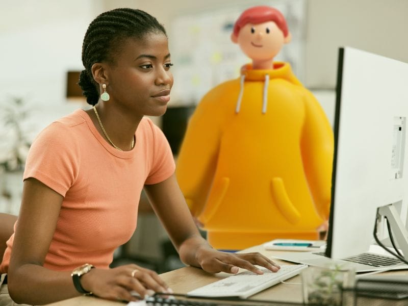 A picture of a social care worker accessing a case management system on a computer.