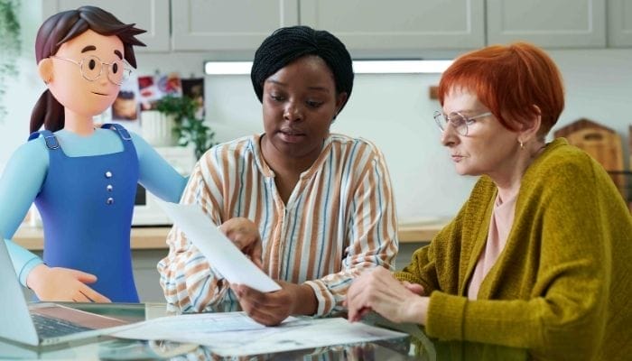 A picture of a social worker and System C character chatting to a adult.