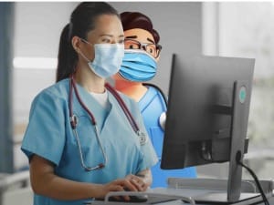 A picture of a System C healthcare character and a female healthcare professional in a neonatal setting.