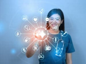 A picture of a healthcare worker using System C's CareFlow Ambient AI solution on an electronic device.
