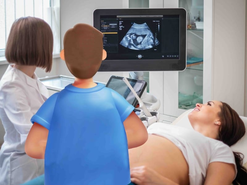 Expecting mother in hospital having a scan with a healthcare professional and a System C character.