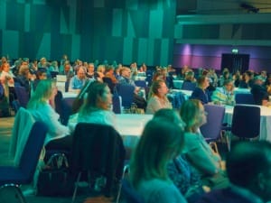 An image of people listening at UserCon 2026