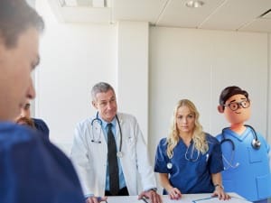 An image of clinicians discussing the VOD model.
