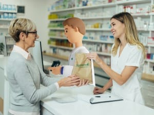 A pharmacist prescribing a patient medicine with a System C character.