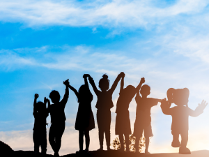 A group of children in front of a sunset with a Liquidlogic Character.