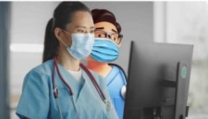A picture of 2 neonatal care specialists look at the BadgerNet Neonatal EPR on a computer. 